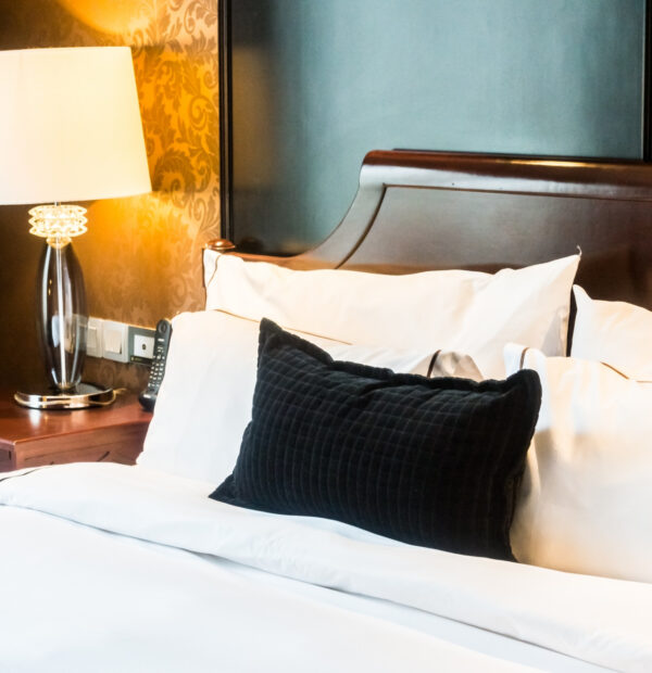 close-up-bed-with-black-cushion